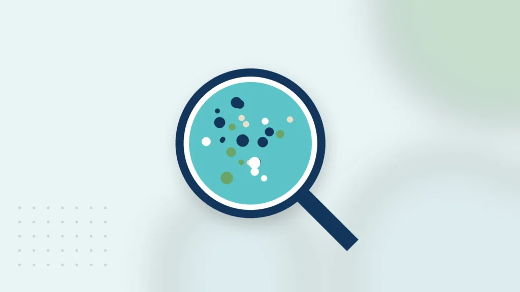 Illustration: a magnifying glass over a water sample with particles