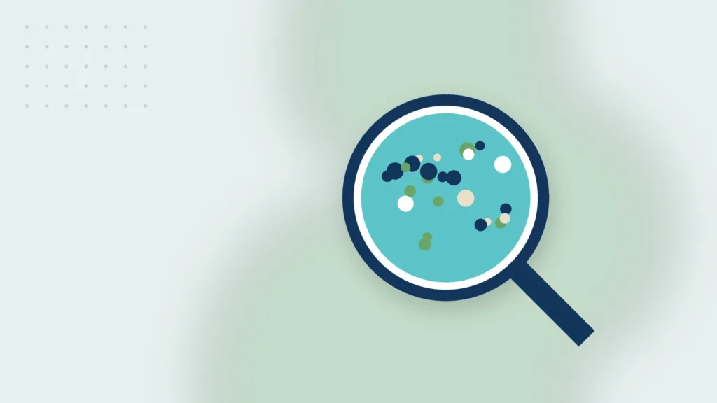 Illustration: a magnifying glass over a water sample with particles