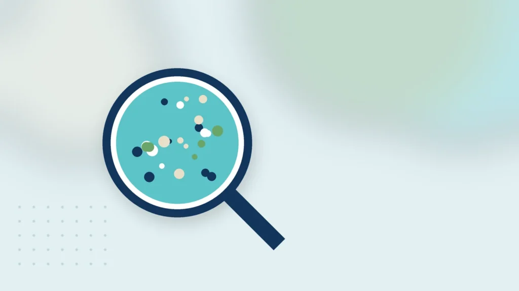 Illustration: a magnifying glass over a water sample with particles